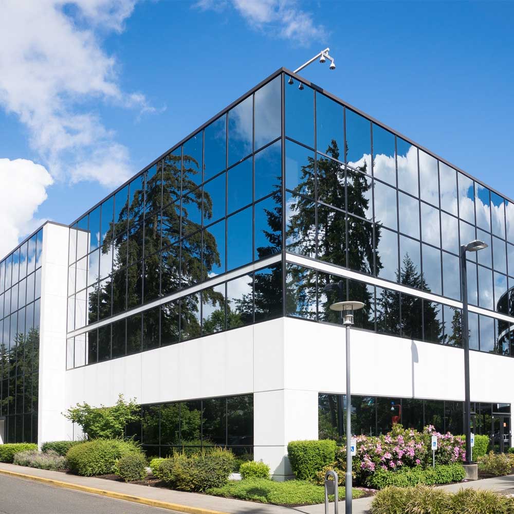 a commercial office building with large glass windows