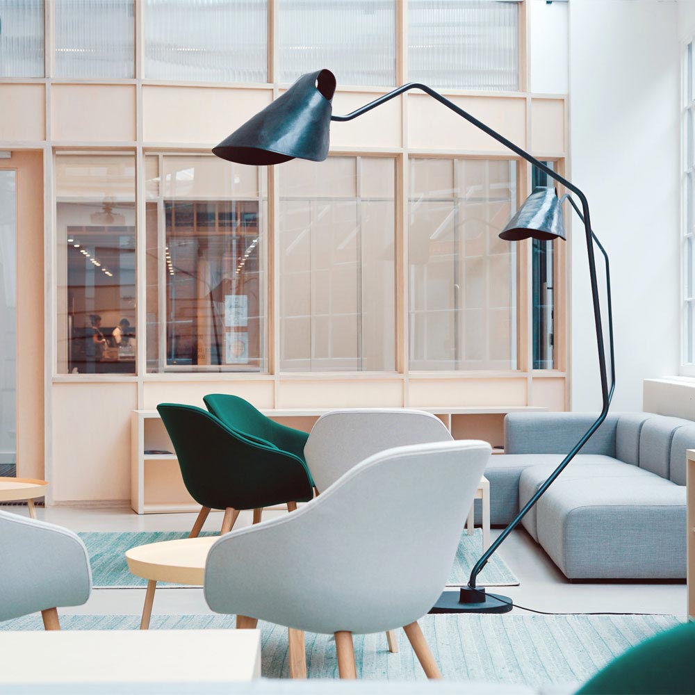 modern office space with couches and a lamp
